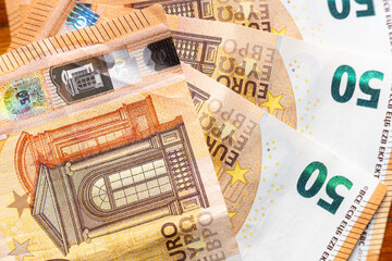 several 50-euro bills, banknote background. Economy concept