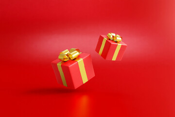 3D rendered illustration of a red gift box icon tied with a shiny gold ribbon against a red background. For festivals, Christmas, Valentine's Day, birthdays, decorations, banners.