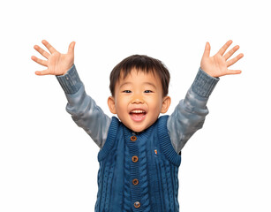 Asian boy wearing a blue sweater vest and long shirt, raising his hands with happy expressions on white background. Copy space advertising products or school services, happy kids and many more