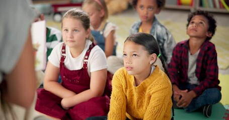 Teacher, reading and children in Kindergarten with storytelling, montessori school and learning in classroom. Kids, listening and woman teach language literacy in fantasy book or preschool education