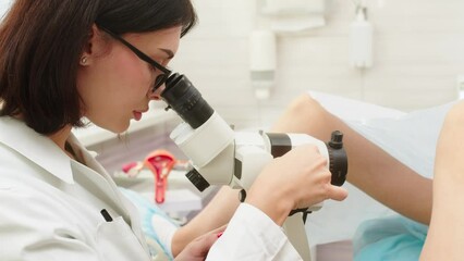 The gynecologist consults the patient and conducts a gynecological examination in preparation for pregnancy. Consultations on pregnancy and childbirth, women's health and teamwork.