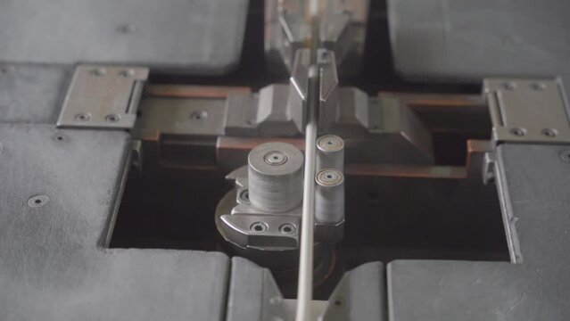 Factory production of heating element. Heating exchanger workshop. Industrial machine bending metal rod. Manufacturing heating element. Mass factory production.