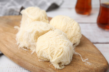 Eastern sweets. Tasty Iranian pashmak on white wooden table, closeup