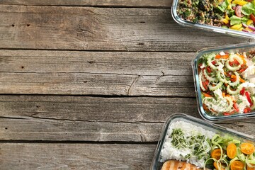 Healthy meal. Containers with different products on wooden table, flat lay. Space for text