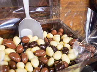 Chocolate Sweets and Candy Close up - Indulge in the Sweet Avalanche, A Tempting Mountain of Colourful Choc Confectionery Delights. Unhealthy diabetic and sugar addiction concept