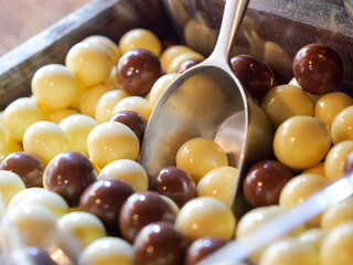 Chocolate Sweets and Candy Close up - Indulge in the Sweet Avalanche, A Tempting Mountain of Colourful Choc Confectionery Delights. Unhealthy diabetic and sugar addiction concept