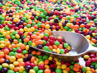 Sweets and Candy Close up - Indulge in the Sweet Avalanche, A Tempting Mountain of Colourful Fruity Confectionery Delights. Unhealthy diabetic and sugar addiction concept