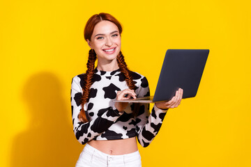 Photo of sweet good mood lady dressed cowskin print top communicating modern device isolated yellow...