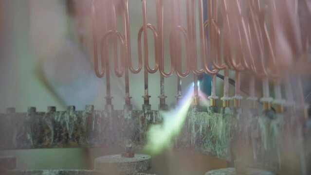 Factory production of heating element. Welding of Heating exchanger in workshop. Manufacturing heating element. Mass factory production.