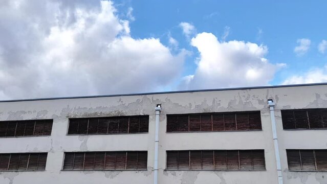 An old industrial building in an industrial zone.