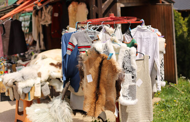 Serbian traditional woolen clothes on hangers, Zlatibor