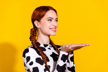 Photo of excited cheerful woman wear cow skin top holding arms empty space isolated yellow color...