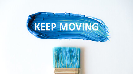 On a bright blue background, a strip of smeared paint and white paper with the text Keep Moving.