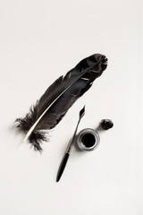 Feather quill, inkpot nearby