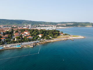 Old fishing town Izola in Slovenia on the Adriatic sea coast, with beautiful seascape and marina, aerial shot. Travel, tourism, and vacation concepts.