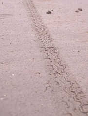 asphalt surface with cracks and scratches in the sand road