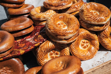traditional Asian flatbread Kazakh tandoor bread on the counter at the bazaar in Kazakhstan