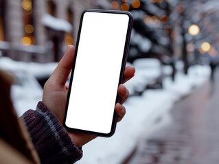 A person holding a smartphone with a blank screen, outdoor wintery cityscape in the background, concept of technology. Generative AI