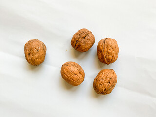 Dried walnuts isolated on white background. Top view, flat lay.