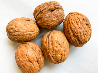 Dried walnuts isolated on white background. Top view, flat lay.