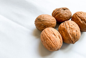 Dried walnuts isolated on white background with copy space for text. Top view, flat lay.