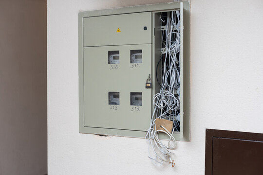 Electric cabinet with Internet and television cables in an apartment building. Niche for wires and cables inside the wall