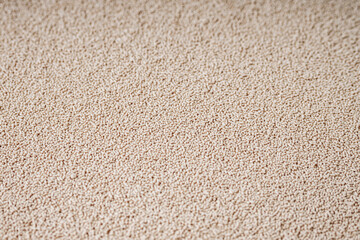 Granulated dry yeast on a white background