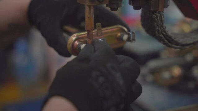 Factory production of heating element. Punctuation or point welding of Heating exchanger in workshop. Close up.