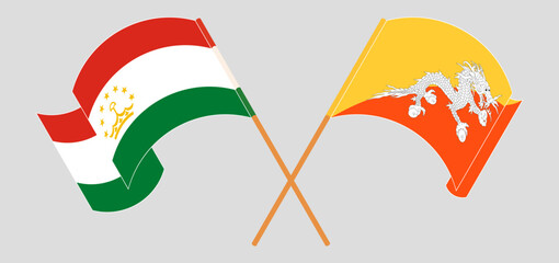 Crossed and waving flags of Tajikistan and Bhutan