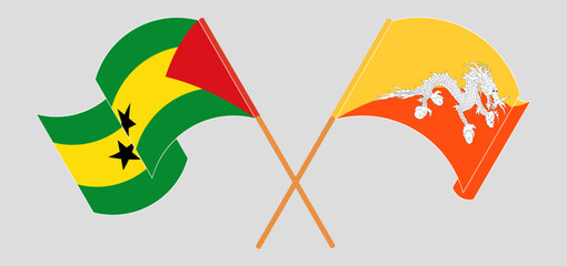 Crossed and waving flags of Sao Tome and Principe and Bhutan