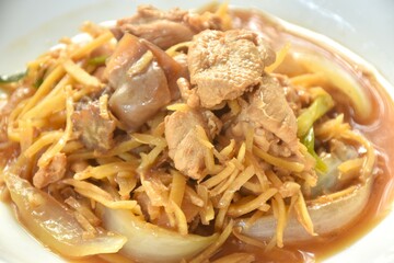 stir fried chicken with slice ginger and black ear mushroom on plate