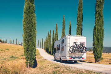 Motor home on the road in Italy, Tuscany- Travel, road trip, adventure concept