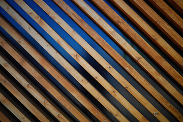 Illuminated diagonal wooden bars texture background