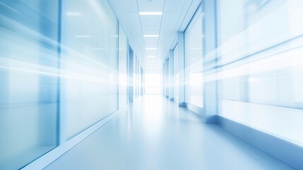 Empty white corridor with glass walls. Blurred motion image in blue and white tones. Medical facility concept. Design for healthcare posters and presentations. Wide angle perspective with copy space.