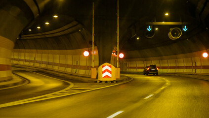turn lane in tunnel, car traffic in the tunnel, lighted car tunnel