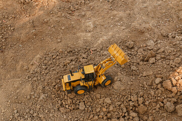 Wheel loader  are digging soil with  in the construction site ,Top view