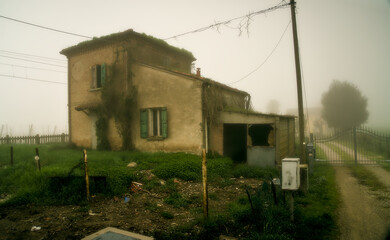 Romagna house from the early 1900s, now empty for a long time, resembles a house of ghosts