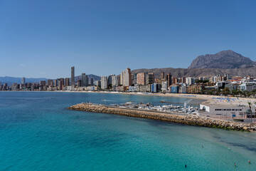 Panorama of Benidorm including the breakwater, small marina, local beach and the majestic Puig...