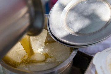 Sugarcane Juice Poured Over Ice at Street Vendor