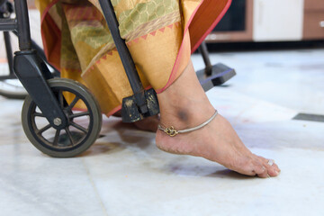 Close up of a woman's feet in a stroller step at home