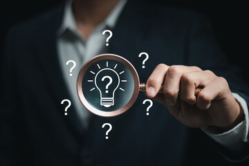 Businessman holding light bulb. Idea concept with innovation and inspiration for business or education, Creative idea. Concept of idea and innovation, Creative thinking and learning.