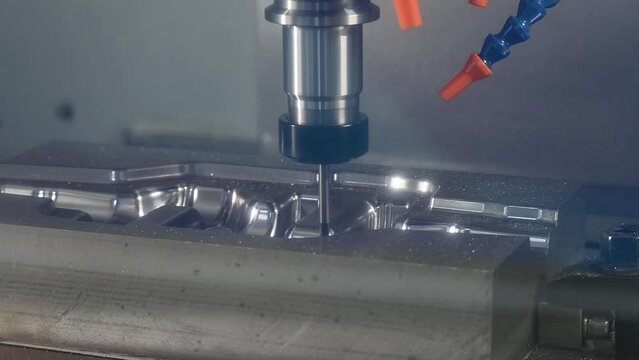The CNC milling machine cutting  forging die part by solid ball end mill tool.