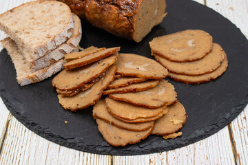 Vegan mock meat; made of wheat gluten; plant based. Steamed; roasted and sliced