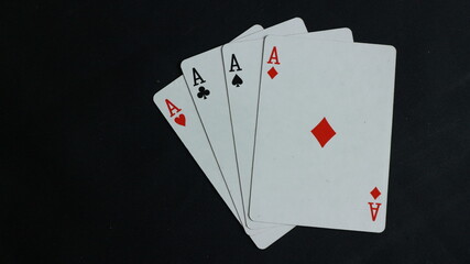 Close up, Four aces on black background. Space for text. Copy space. Casino and Poker Concept.