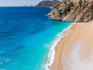An aerial view of Kaputaş Beach, Kalkan, Turkey, showcasing the turquoise waters of the...