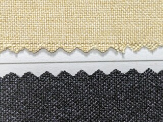 Closeup detail of multi color fabric texture samples on white background.