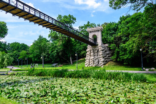 Renovated suspended metallic bridge in Nicolae Romaescu park from Craiova in Dolj county, Romania, in a beautiful sunny spring day