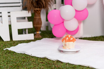 Closer view of first birthday decoration with birthday cake