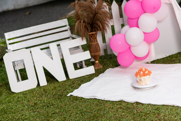 Macro view of first birthday decoration with cake