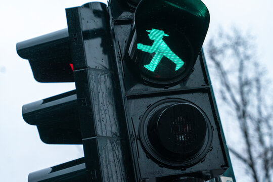 Berlin, Germany - December, 24, 2023   Ampelm&auml;nnchen The little green man with hat on traffic lights in the former East Germany